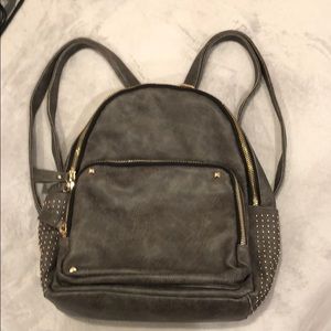 Backpack with gold studs